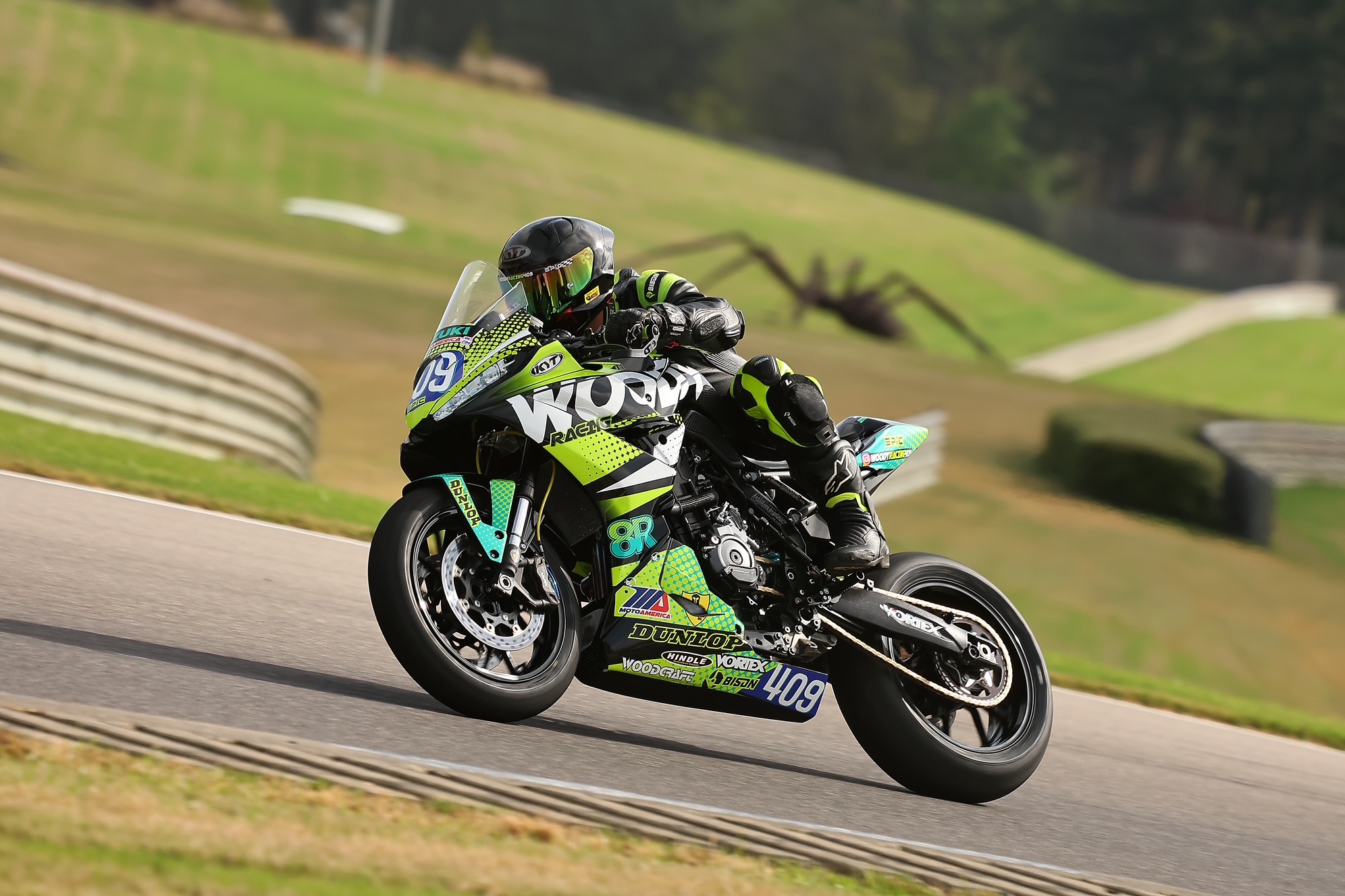 Jonathan Woodall racing the number 409 motorcycle on track